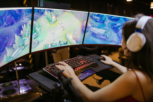 A girl playing a game on her PC