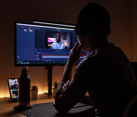 A man editing a video on a computer