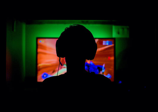 Silhouette of a gamer playing a video game