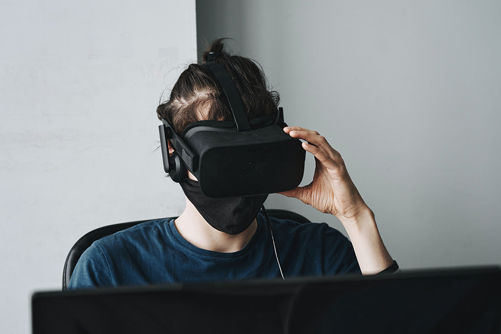 A person using a VR headset to game