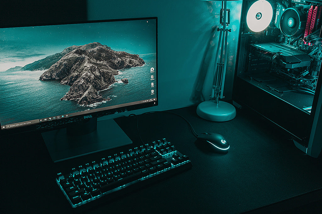 A blue-colored PC setup on a desk
